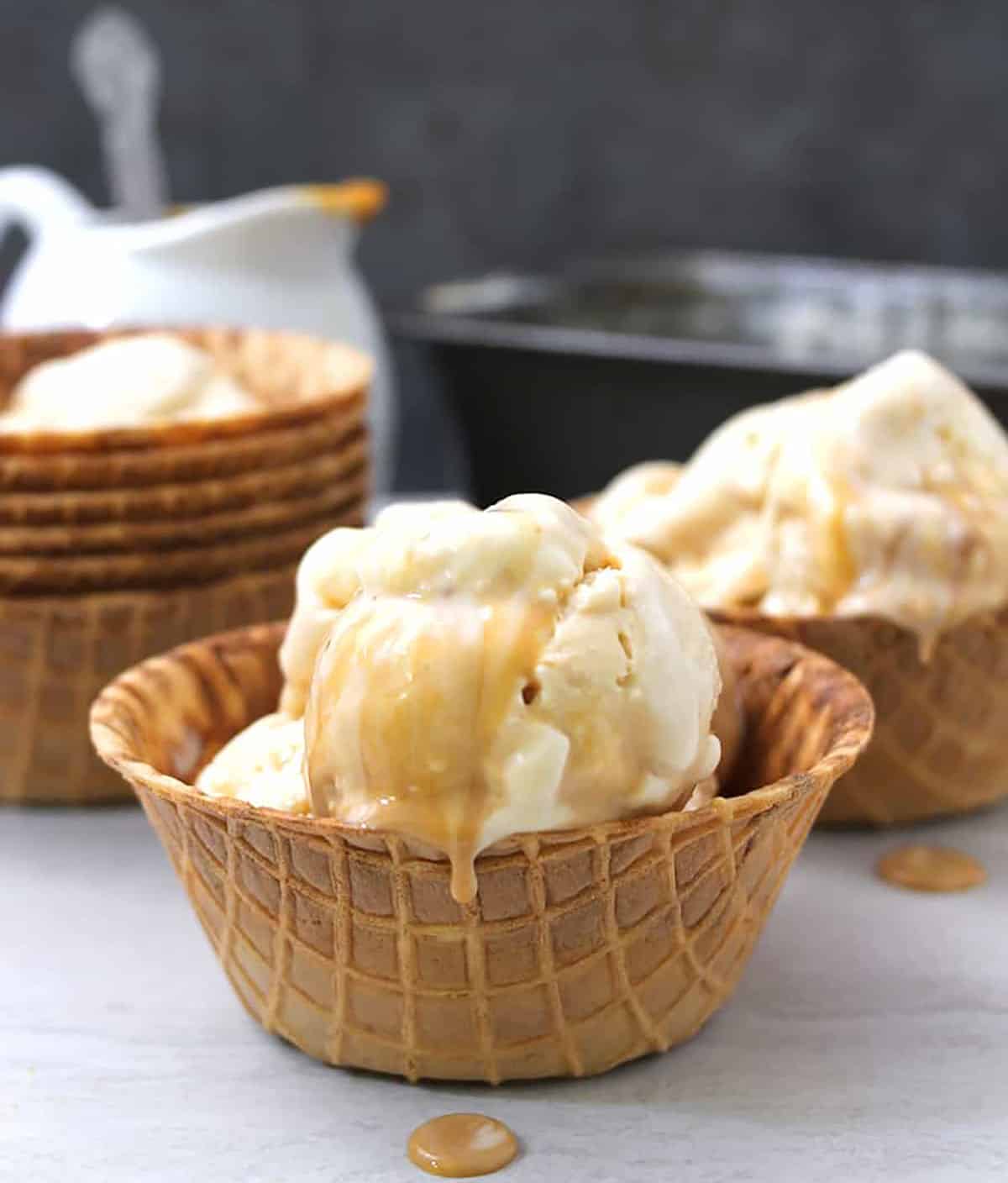 scoop of caramel ice cream in a waffle bowl. 