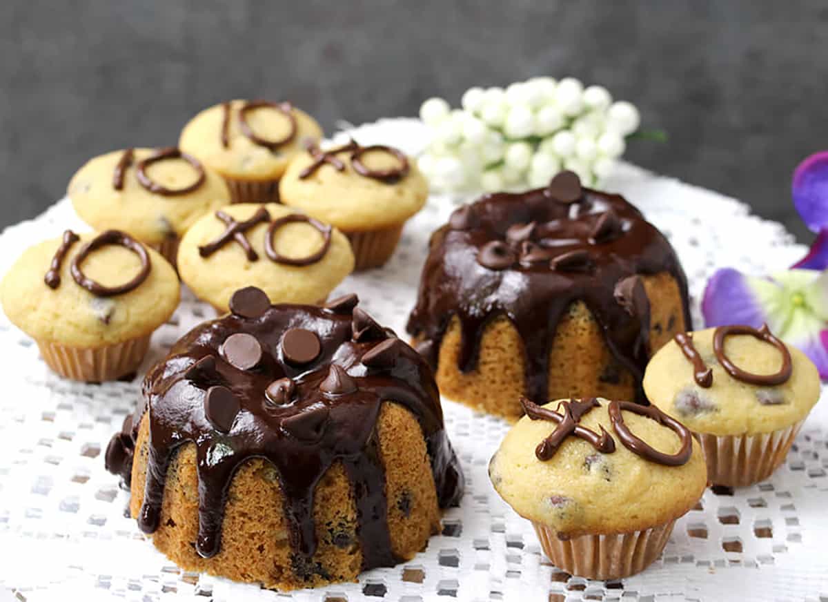Easy and super moist chocolate chip cake and mini cupcakes with chocolate glaze. 