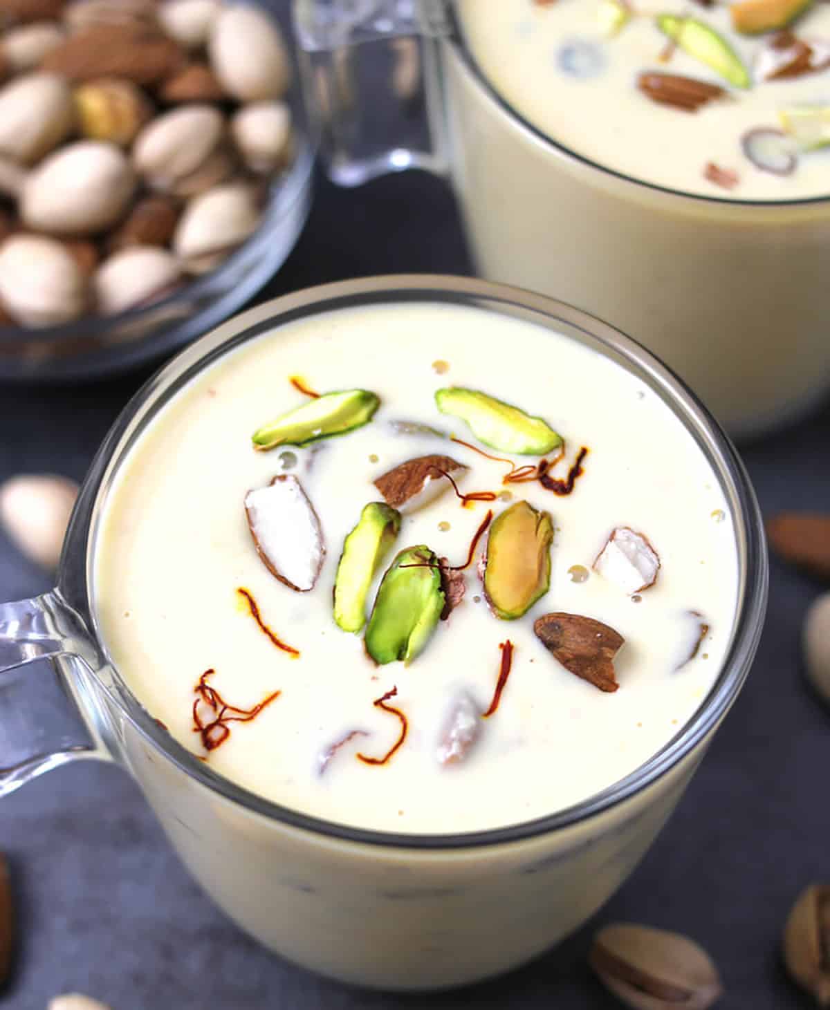 Basundi sweet - Traditional Indian milk dessert served in a glass bowl garnished with nuts. 