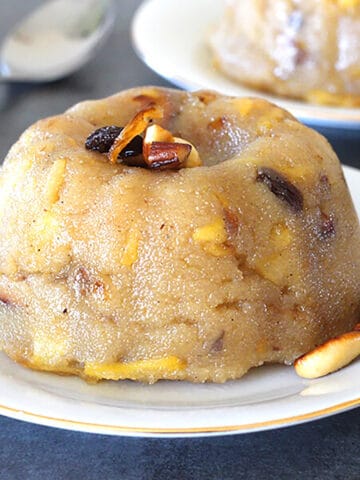 Best India sheera dessert with apples. Apple Sooji Halwa/ Rava Kesari - Indian sweet for festivals.