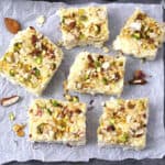 Traditional Indian kalakand sweet slices (Indian milk cake or cheesecake) garnished with nuts.