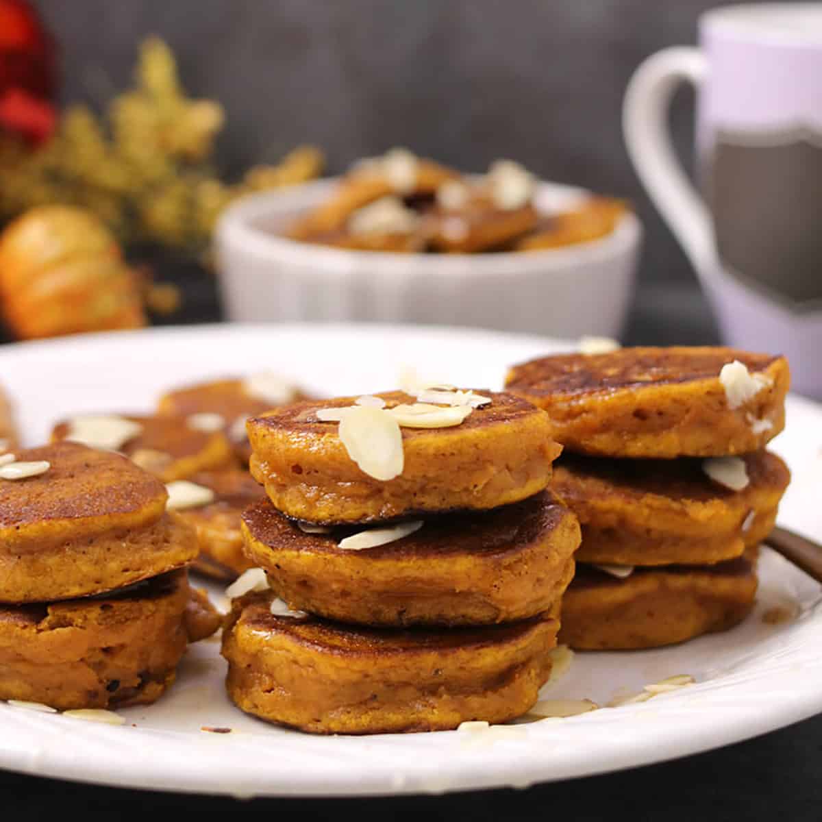 Vegan pumpkin pancakes or mini silver dollar pancakes for autumn and holiday breakfast. 