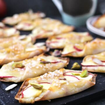 Apple Cream Cheese Danish using Wonton Wrappers served on a black serving tray.