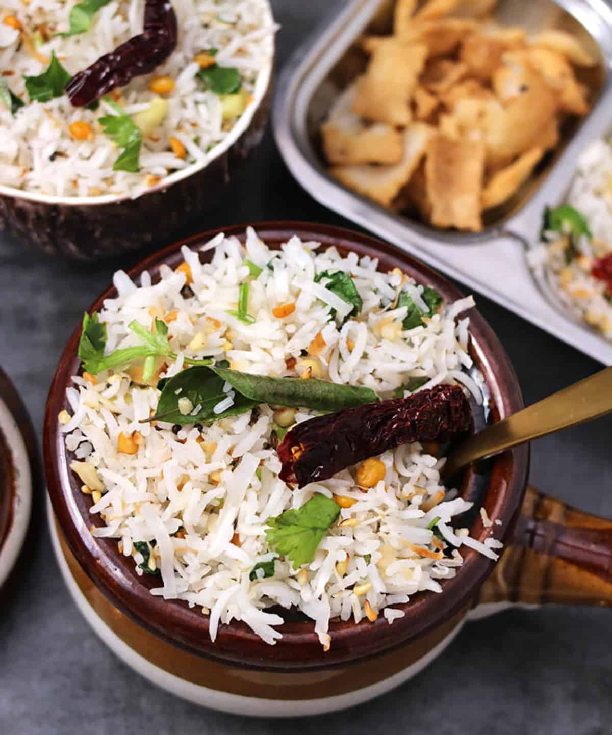 Best coconut white rice or coconut basmati rice in a serving bowl with golden spoon. 