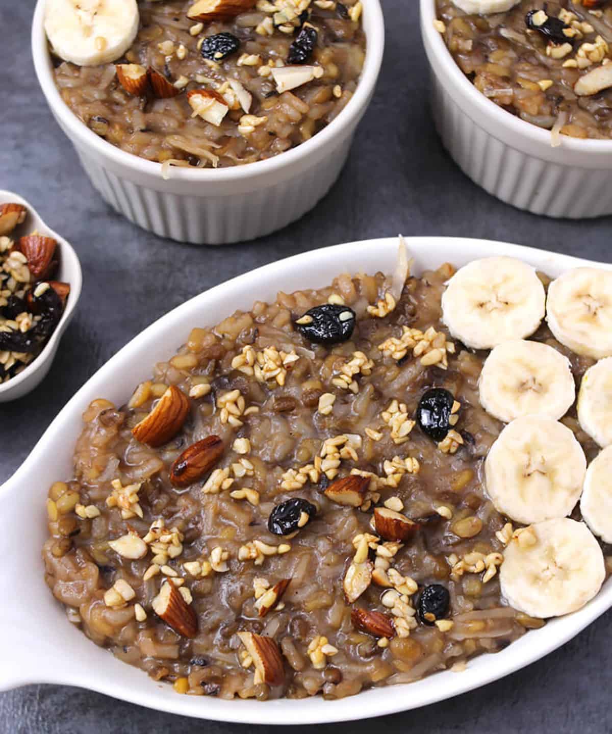 top view of temple style khichdi or pongal prasadam garnished with bananas, nuts of your choice 