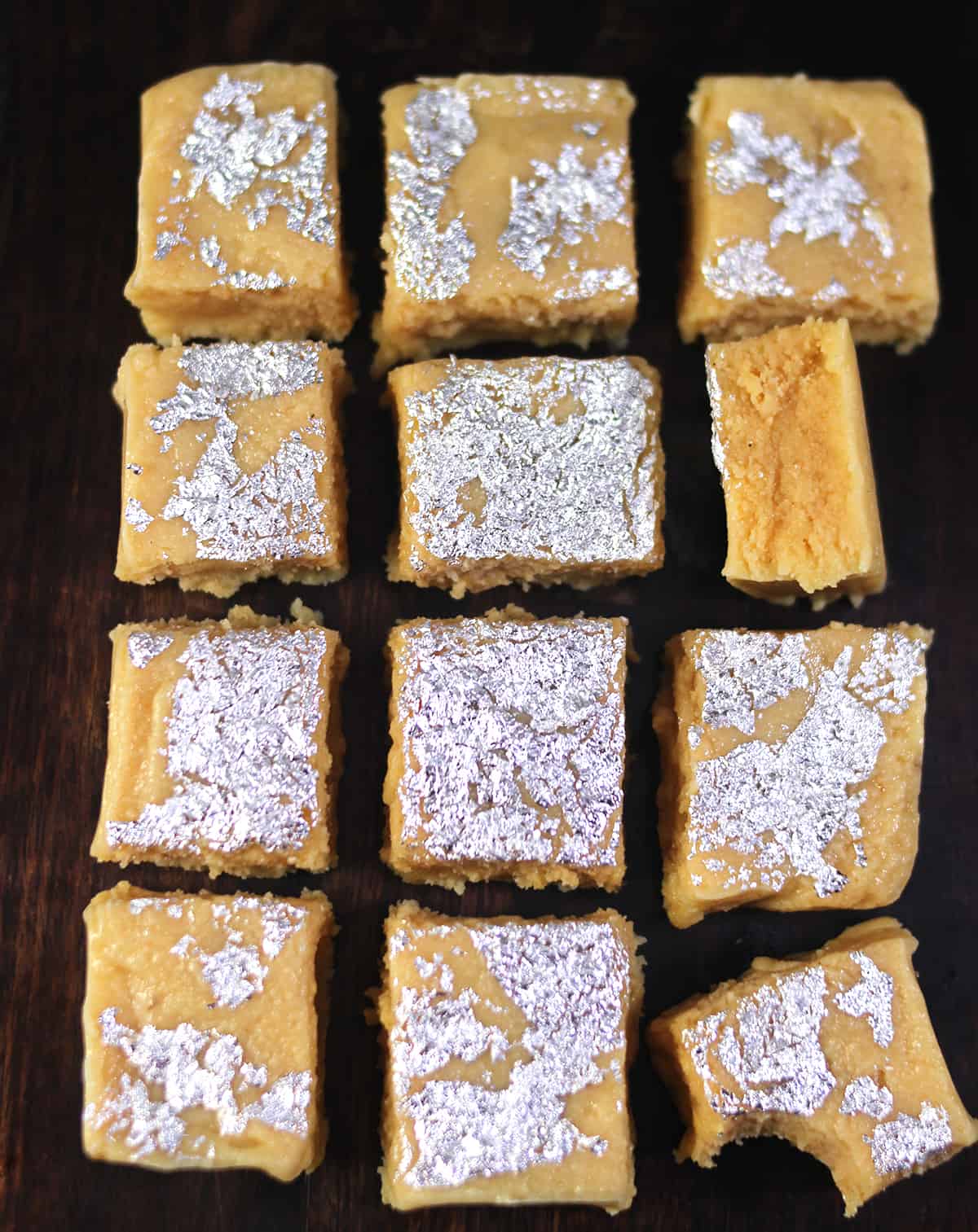 Showing the perfect texture of milk barfi or burfi sweet with milk powder. 