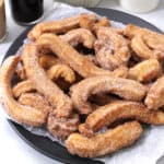 Best homemade churros recipe served with dulce de leche sauce. Mexican churros (Eggless, vegan).