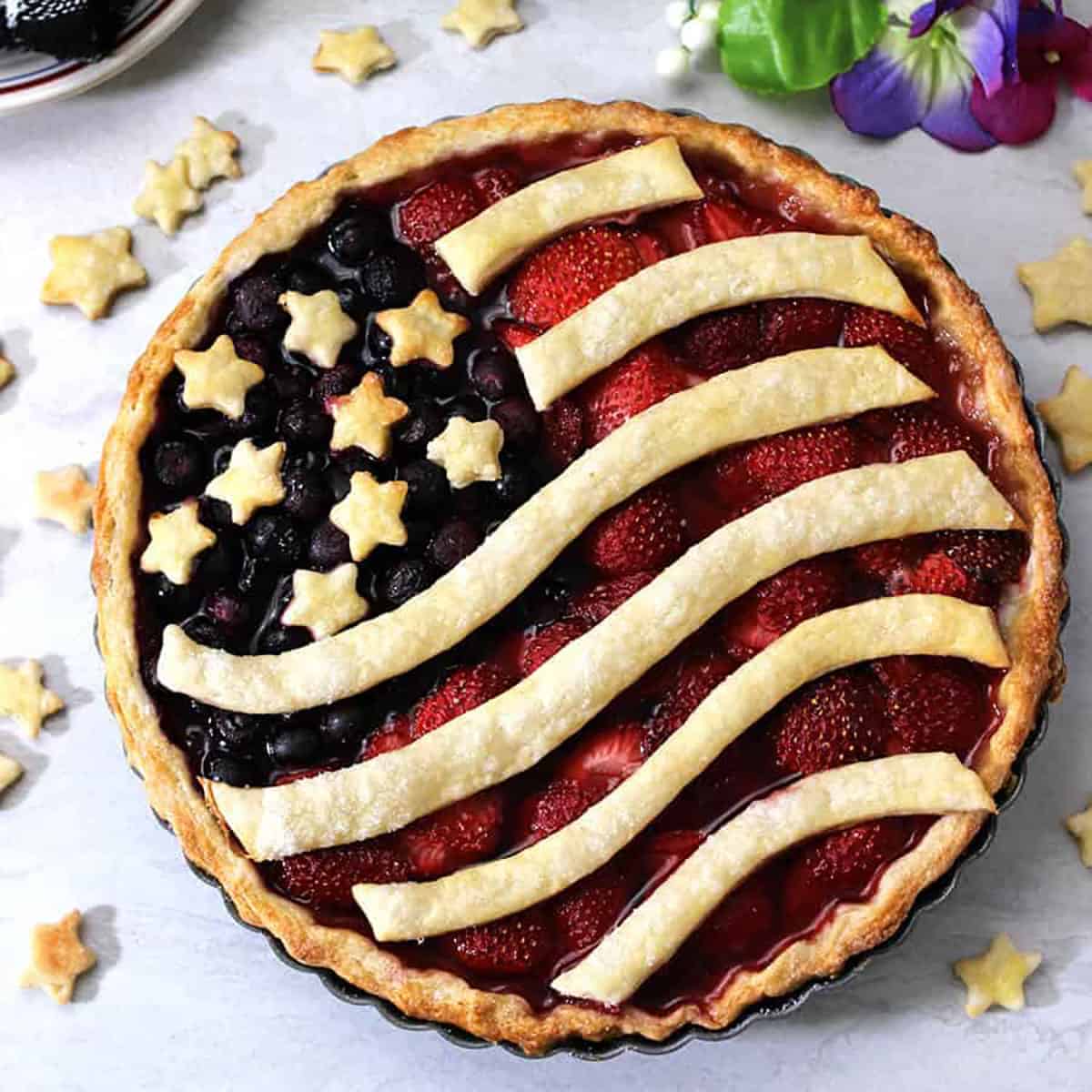Mixed berry pie or American flag pie with stars and stripes.