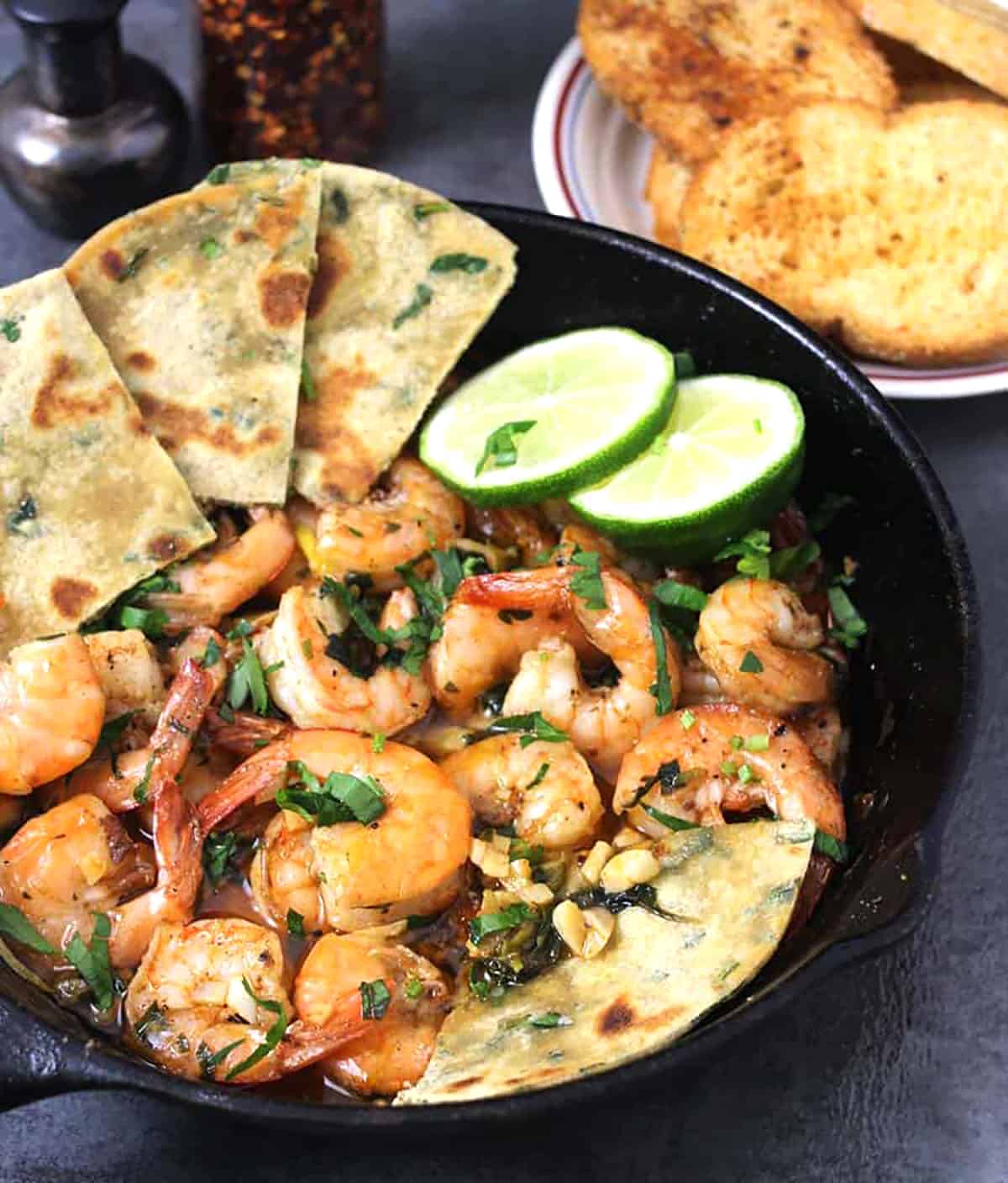 Best shrimp recipe for dinner - butter garlic shrimp or prawns in a cast iron pan. 
