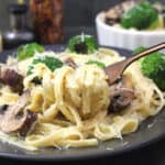 Best fettuccine alfredo pasta on a serving plate. Easy homemade alfredo sauce for pasta.