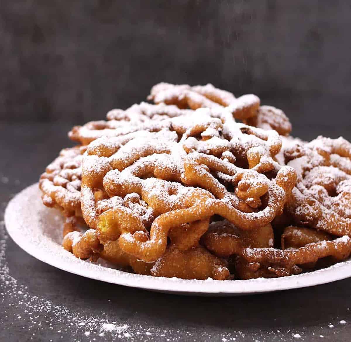 Side view of the best funnel cake recipe made at home from scratch
