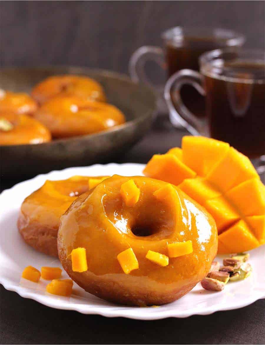 Mango Doughnuts (Donuts) with Mango Glaze, How to make best homemade doughnuts #doughnuts #donuts #glaze #icing #frosting, mango recipes, summer breakfast and desserts, yeast donuts, glazed donuts, vegan donuts, holiday breakfast and dessert, air fryer donuts, baked donuts, instant pot recipes, mango recipes, holiday breakfast ideas