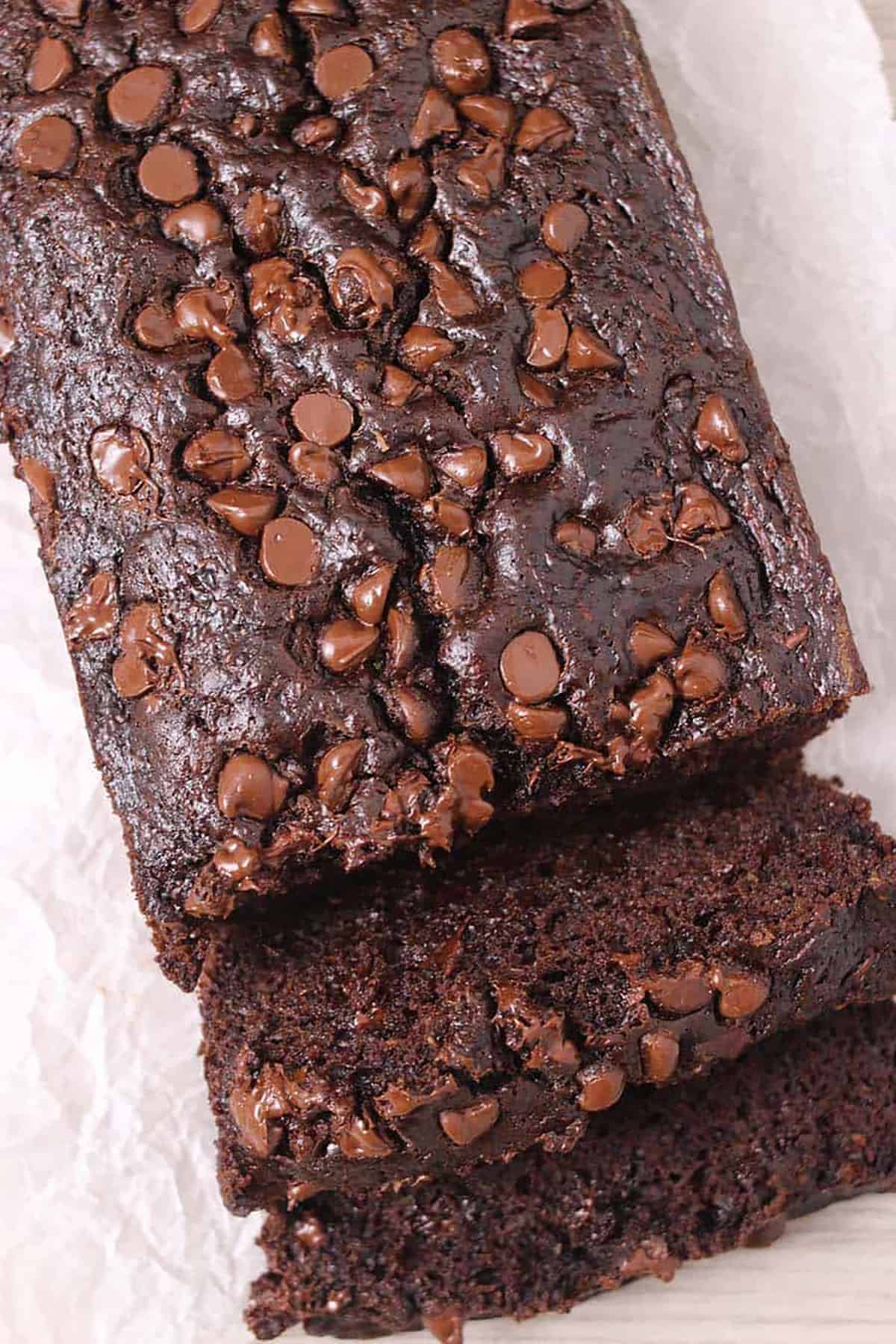 healthy chocolate chocolate chip zucchini bread with moist slice.