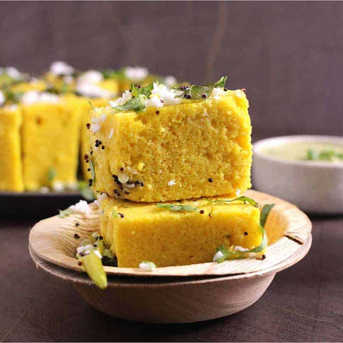 Dhokla (Khaman Dhokla) is a soft and fluffy Gujarati recipe for breakfast or snack using besan.