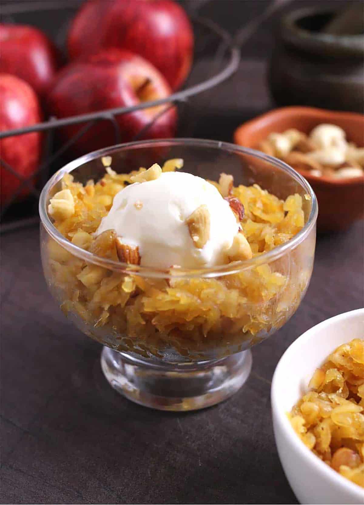 Bowl of homemade apple halwa recipe with vanilla ice cream. 