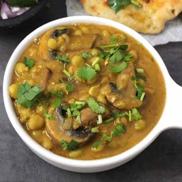 Matar mushroom masala recipe | Indian mushroom peas curry served with naan, roti, rice, etc.
