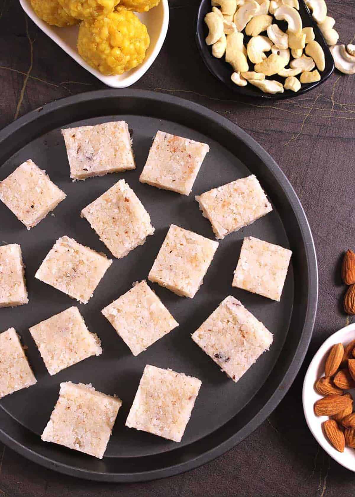 Best Indian coconut burfi (nariyal barfi / kopra pak) sweet on a serving plate.