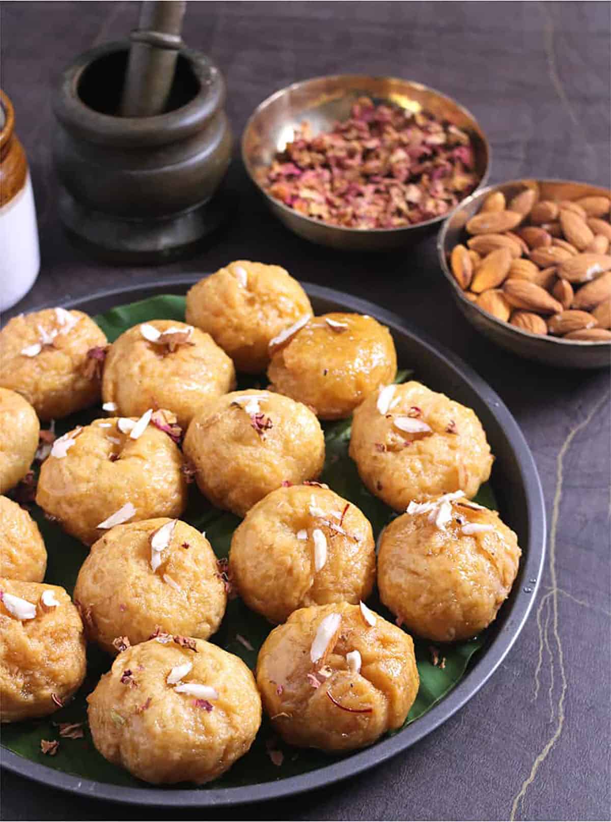 Homemade balushahi arranged on serving plate garnished with nuts to make it look festive for Diwali, Navratri 
