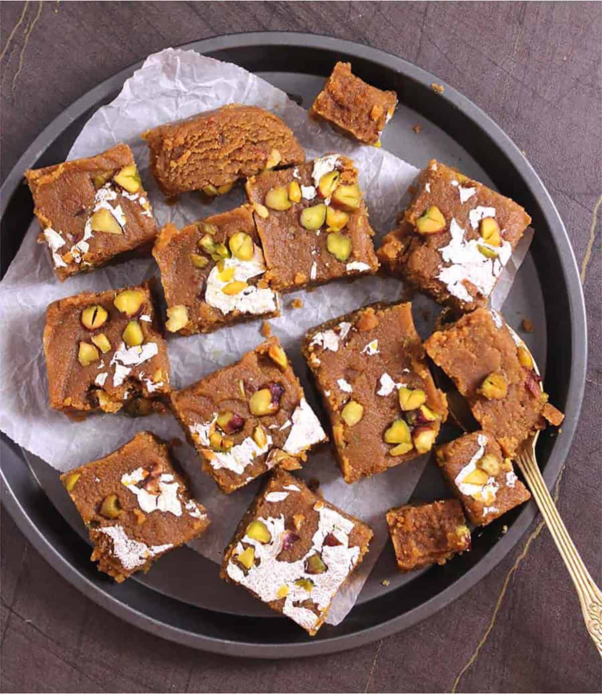 Serve mohanthal dessert like burfi or you can even eat it with spoon 