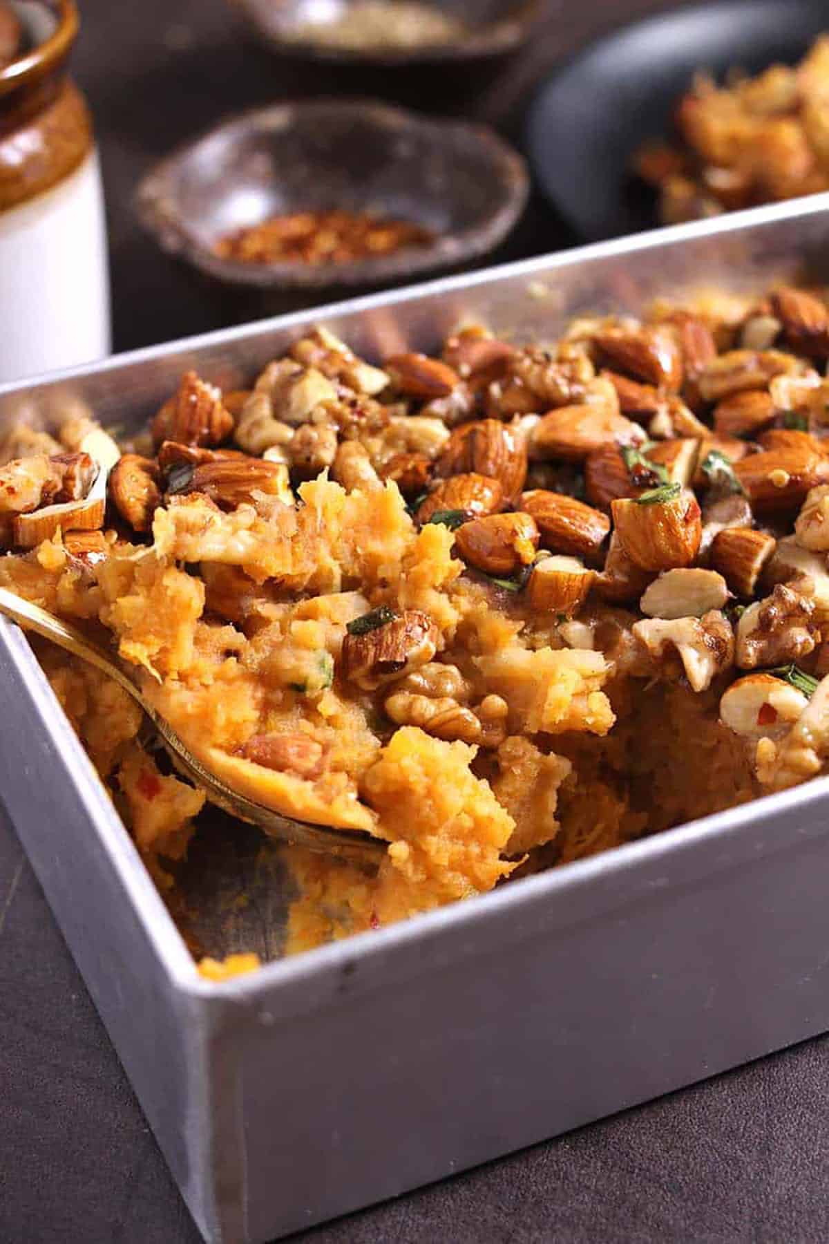 Creamy and savory, healthy sweet potato casserole topped with nuts