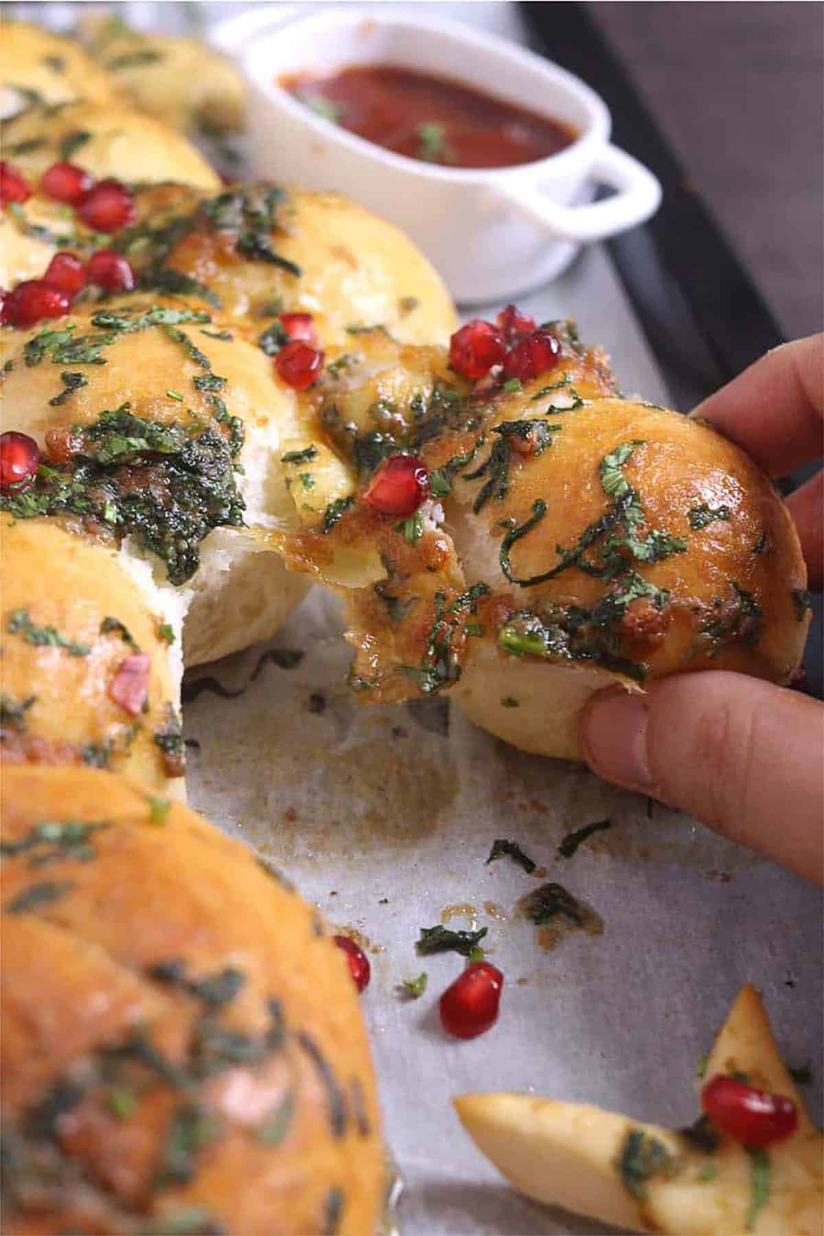 Homemade holiday christmas themed cheesy garlic pull apart bread with pizza dough 