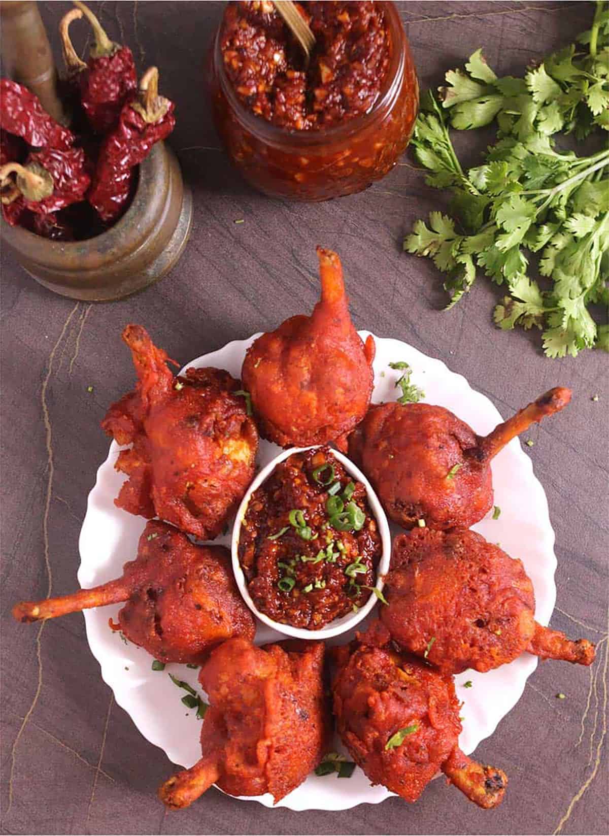 Restaurant-style crispy and juicy chicken lollipop served with spicy szechuan sauce.