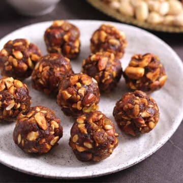Easy energy balls with dates or dry fruit laddu (ladoo) on a plate.