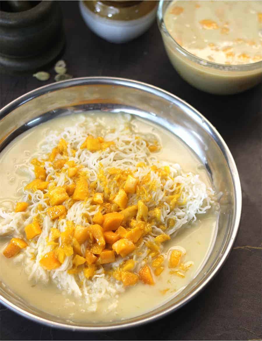 Mango rasayana served along with rice shavige in a plate.
