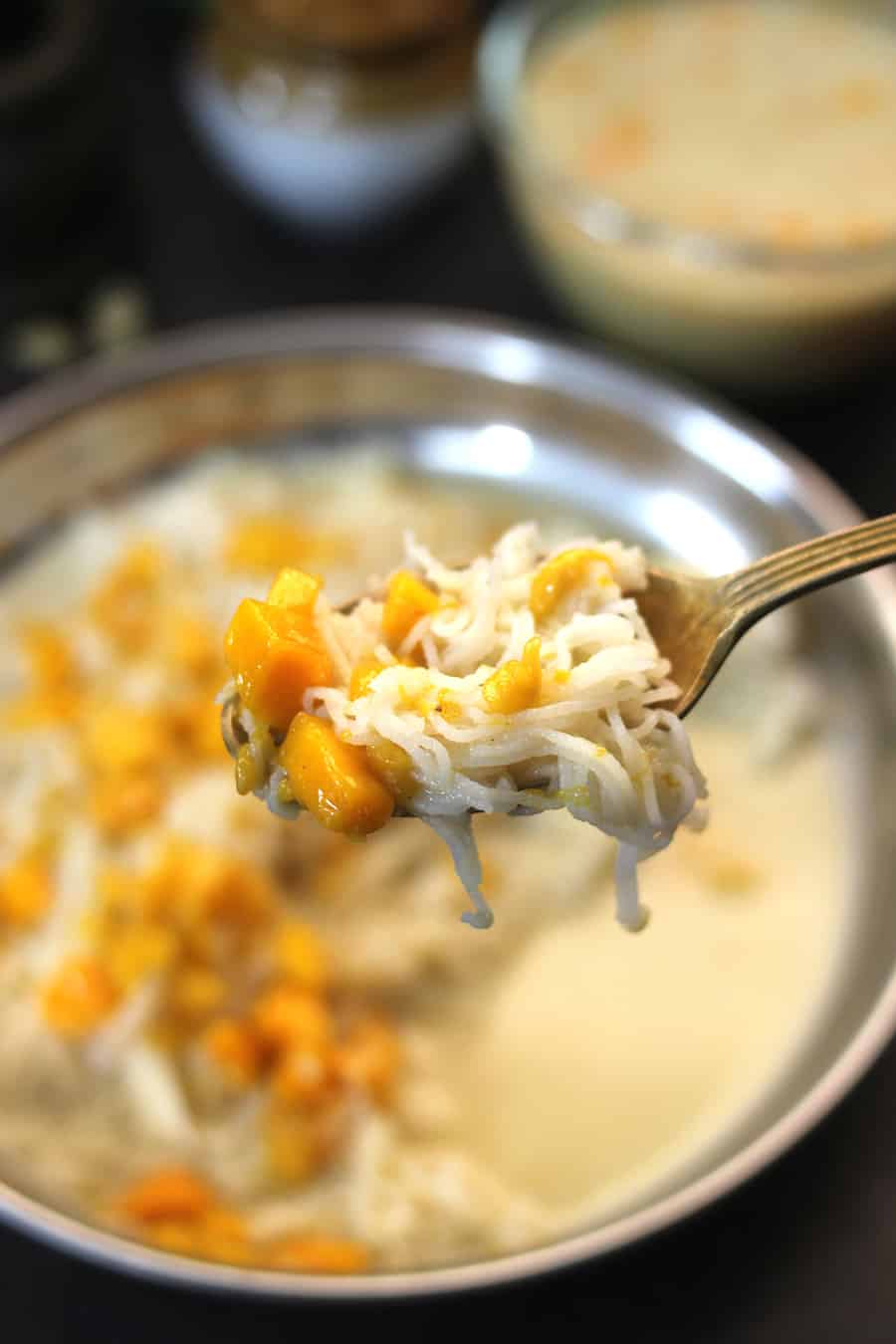 A spoon of rice shavige and mango rasayana.