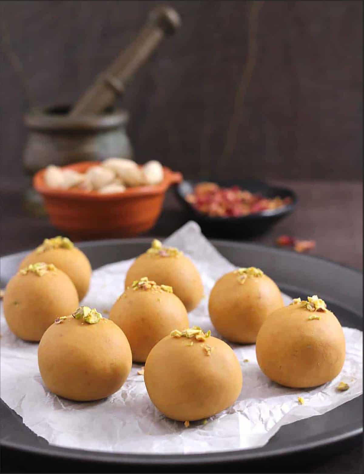 quick and easy homemade besan ladoo on a serving plate. Indian dessert balls.