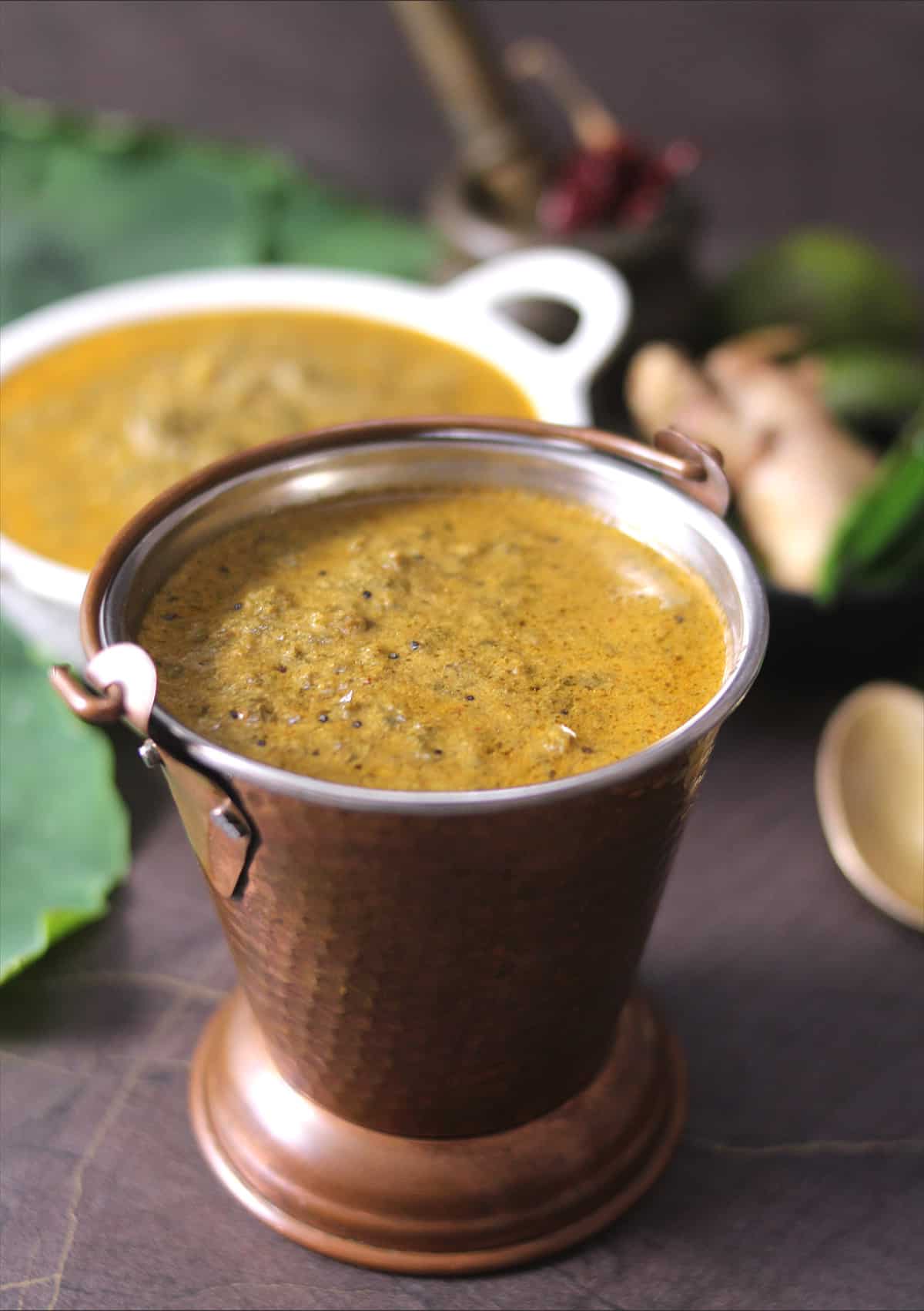 Alvati or colocasia leaves curry served in brass bucket