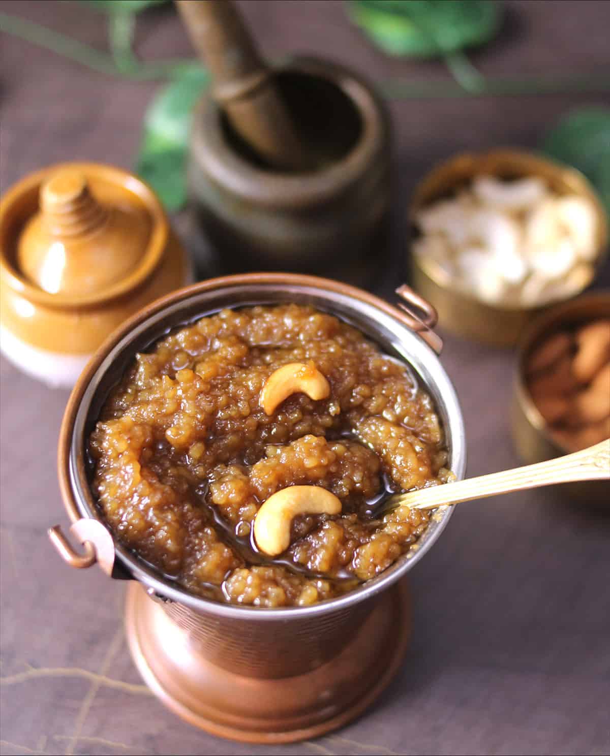 Temple Style Sweet Pongal with Jaggery served in brass bucket and golden spoon