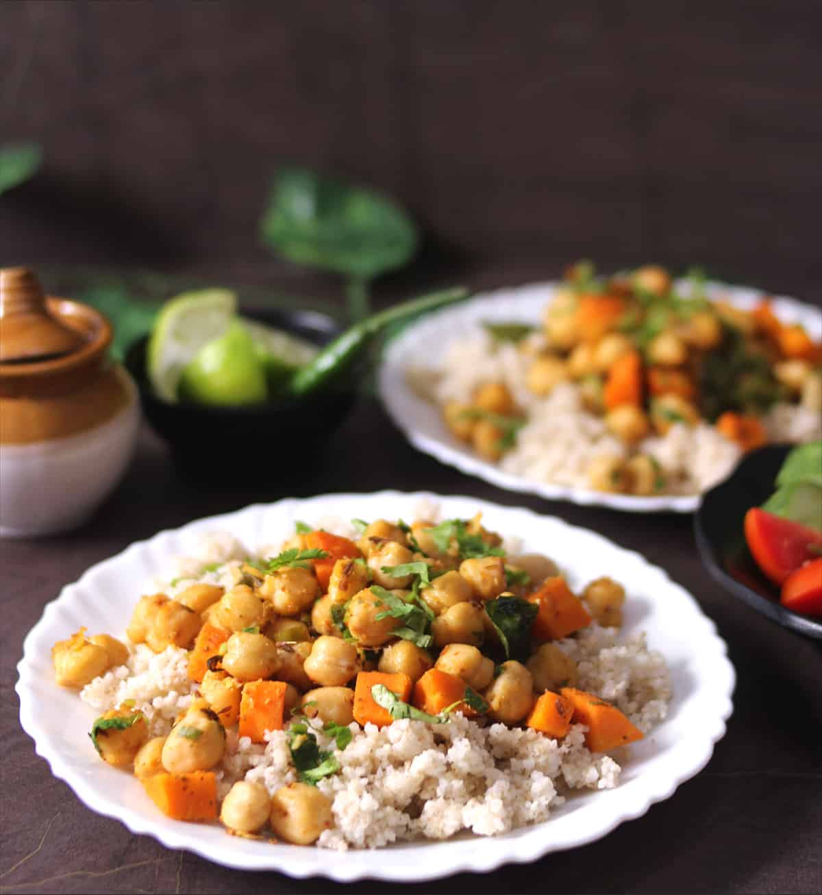 Perfectly cooked millet with chickpeas stir fry on top, complete vegetarian meal