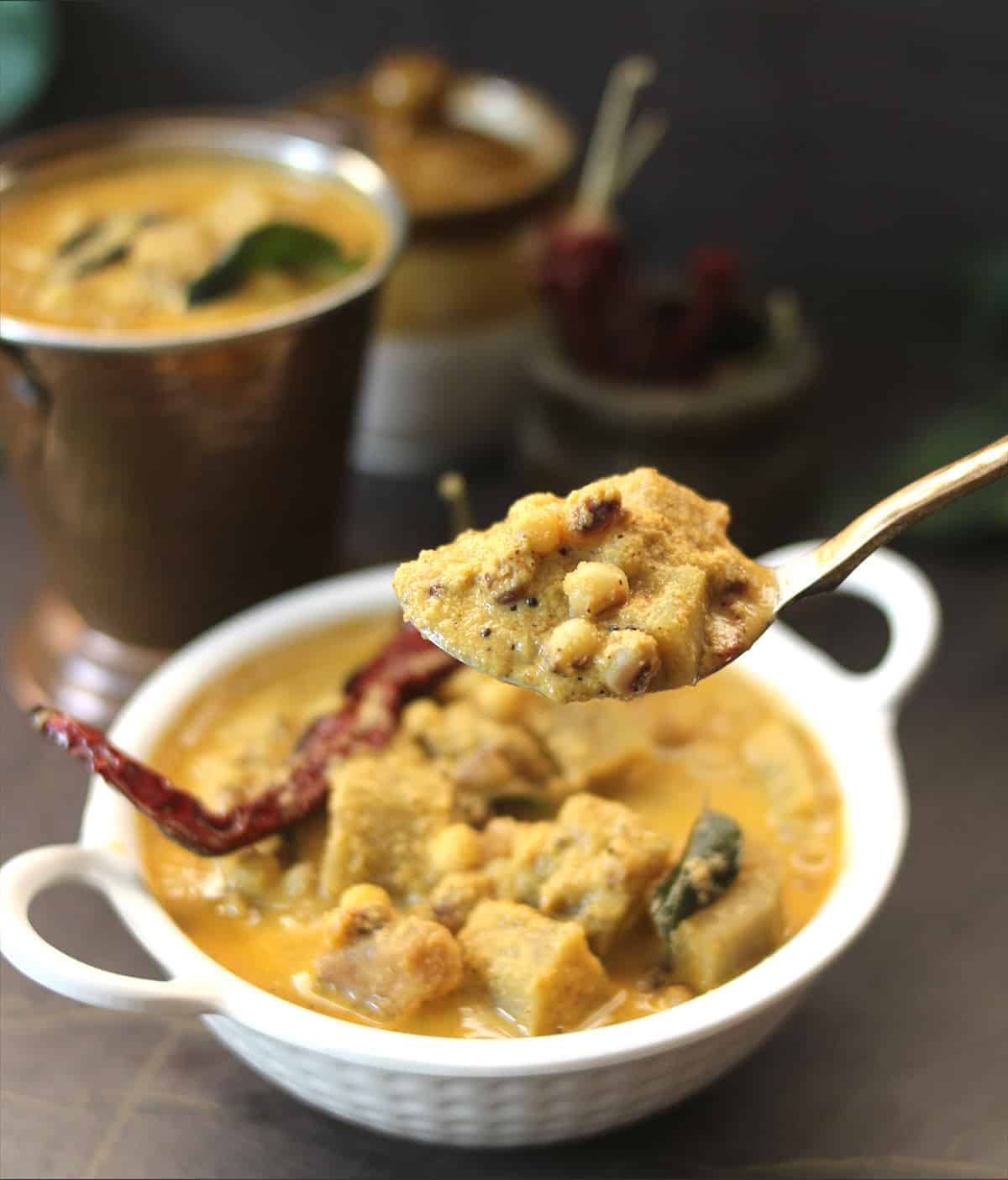 Temple Style Konkani Tori Gashi, holding in spoon, vegan pigeon peas curry