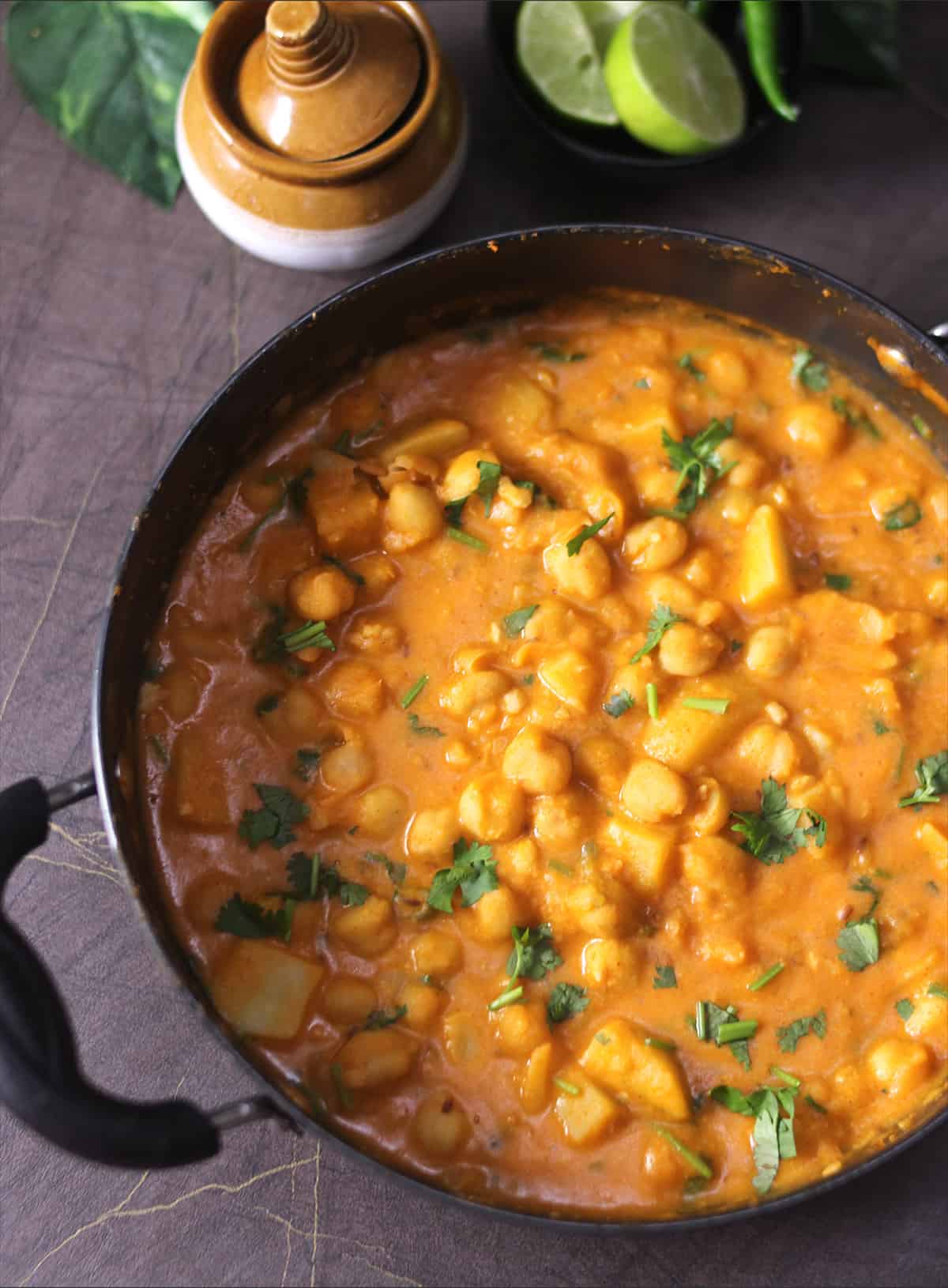 Top view of creamy and rich vegan chickpeas curry with basic minimal ingredients 