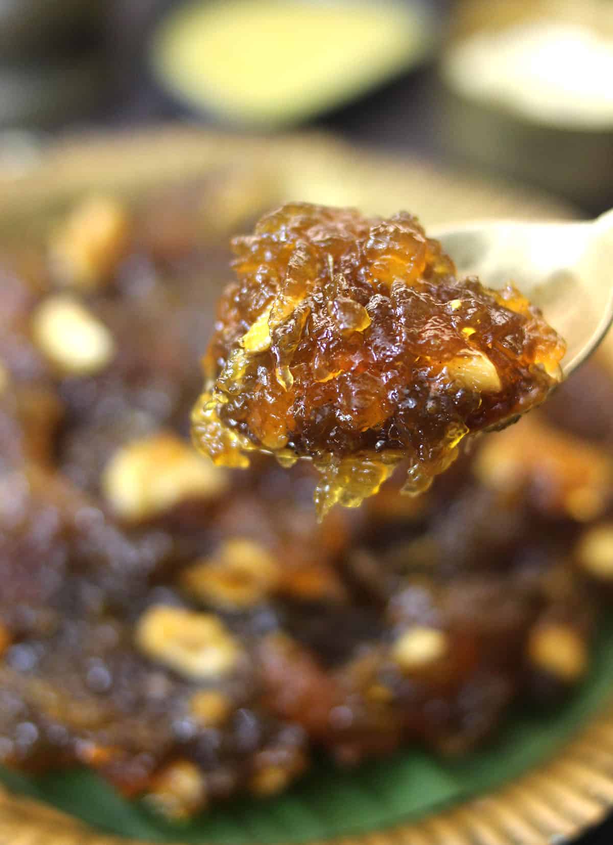Holding spoon of best Indian sweet, halwa