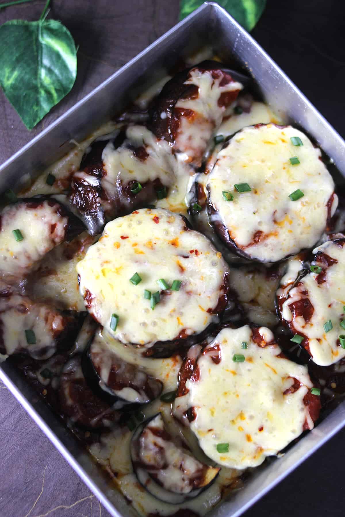 Top view of cheesy eggplant casserole in baking pan #casserole