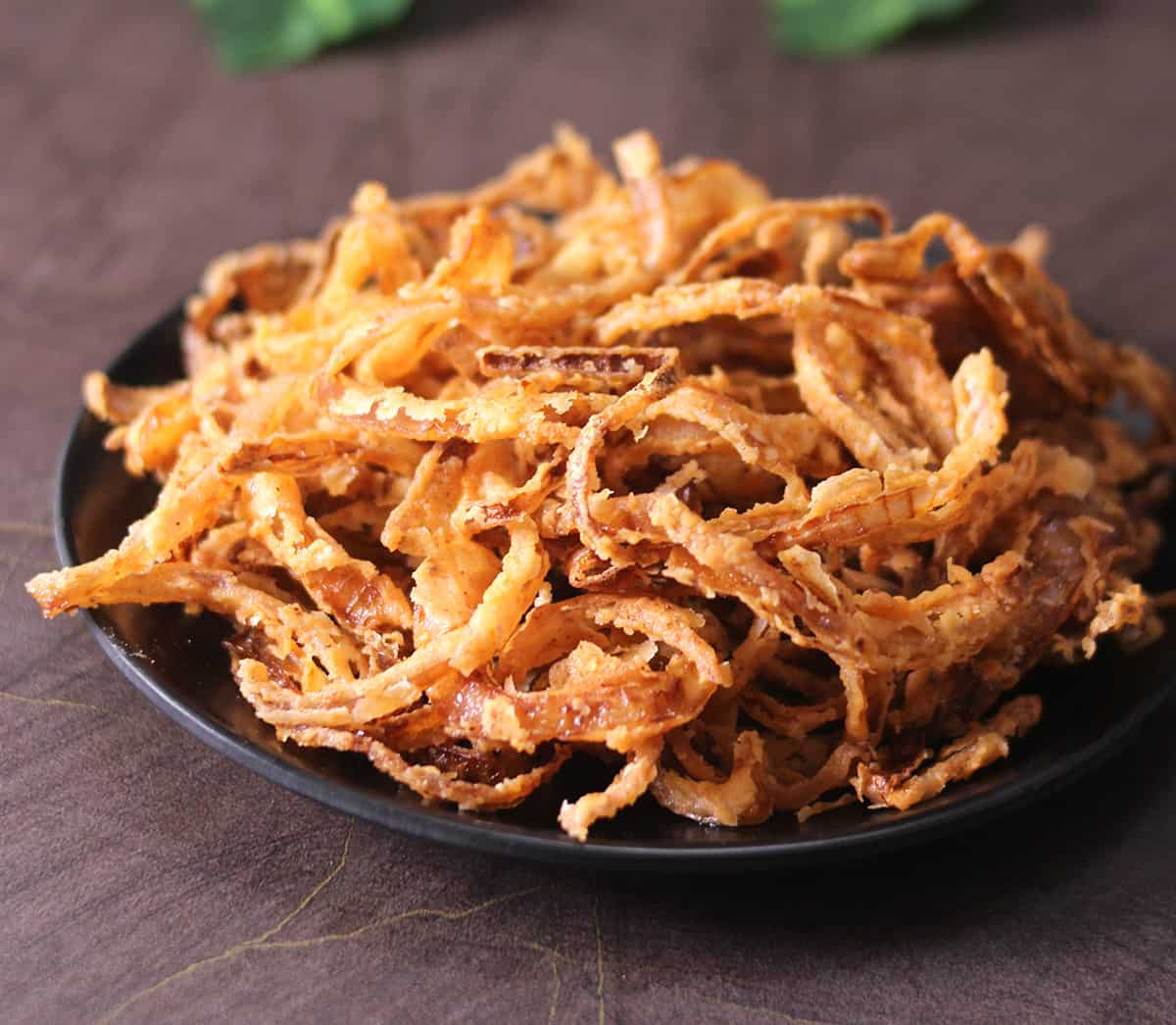 crispy fried onions on black plate  ready to use for green bean casserole 