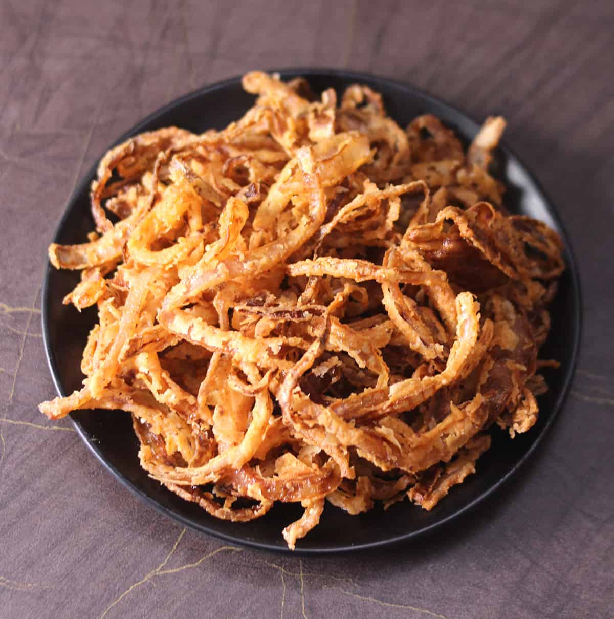 Top View of Homemade crispy fried onions from scratch 