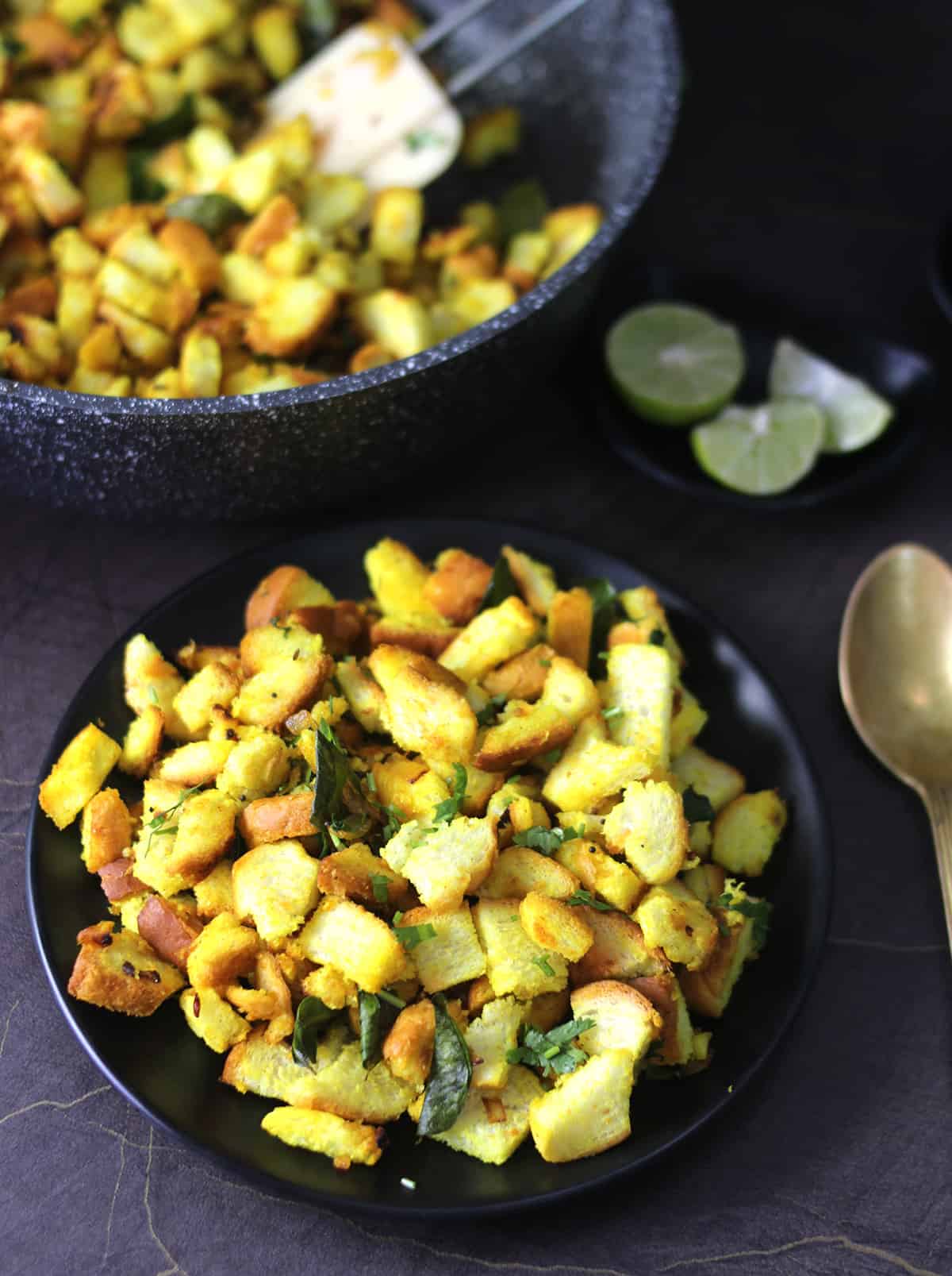 Bread upma or Indian masala bread for breakfast and snack served on black plate 