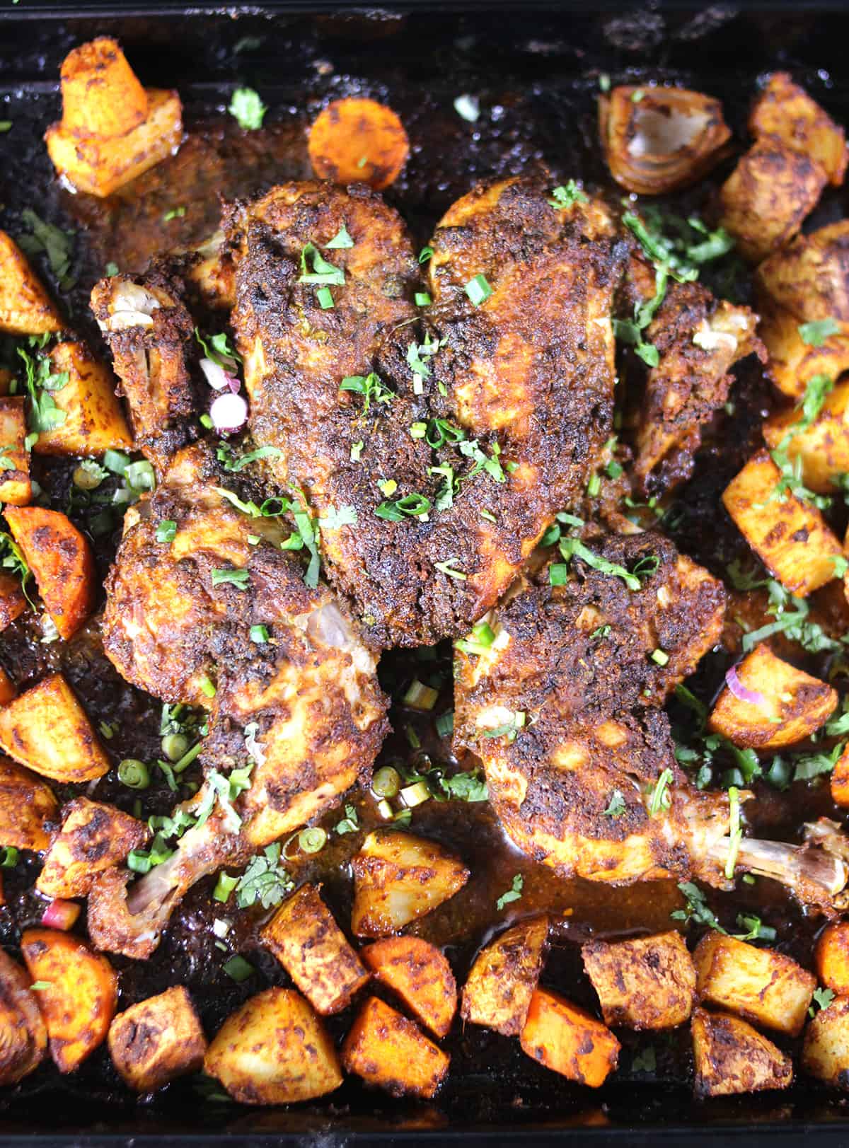 Top View of the best spatchcock chicken roast recipe with vegetables for Thanksgiving dinner. 