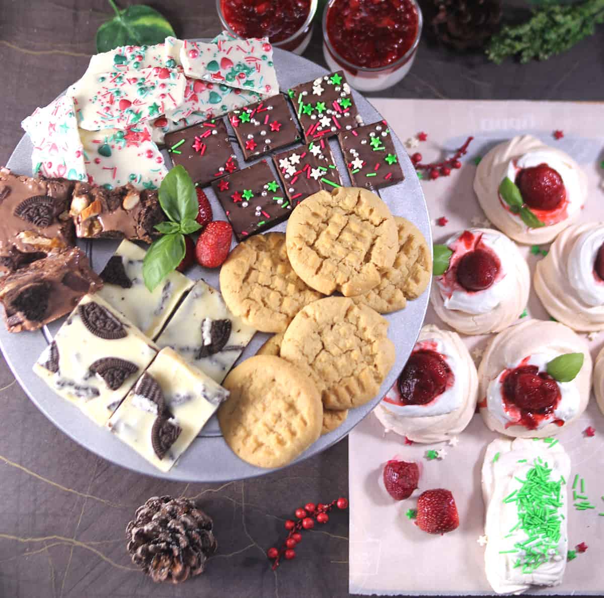 christmas dessert table with pavlova Christmas tree, fudge, candy barks, cookies, fantasy fudge 
