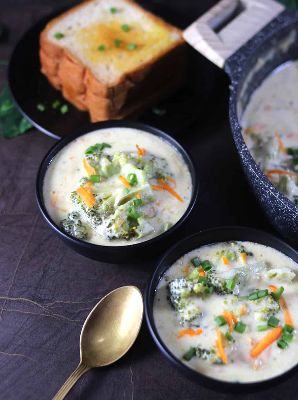 2 bowls of hot and fresh homemade broccoli cheddar soup recipe 