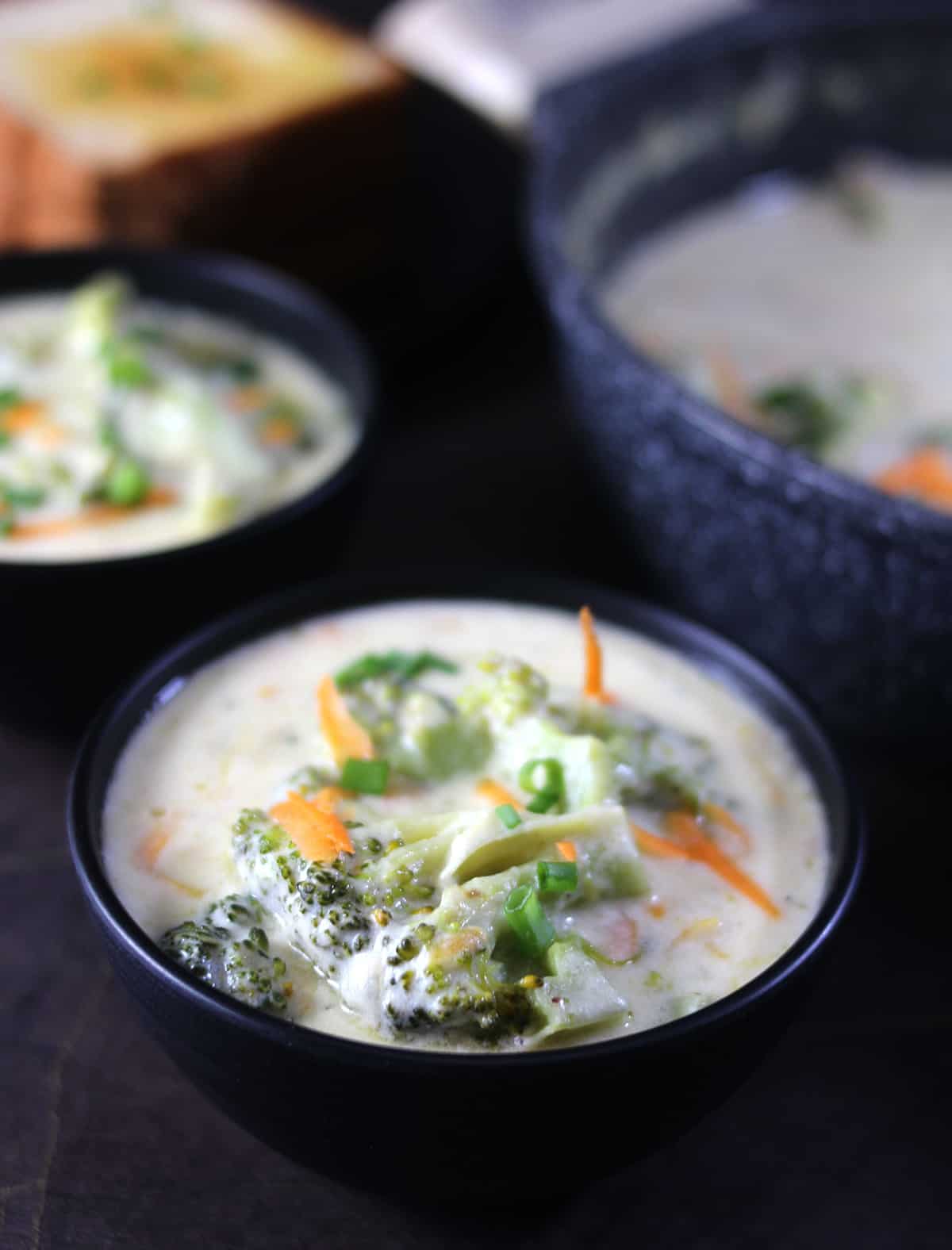 best broccoli cheddar soup recipe served in black bowl 