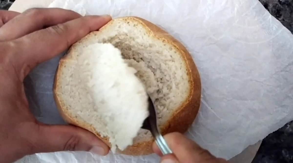 scoop out the center of the bread. 