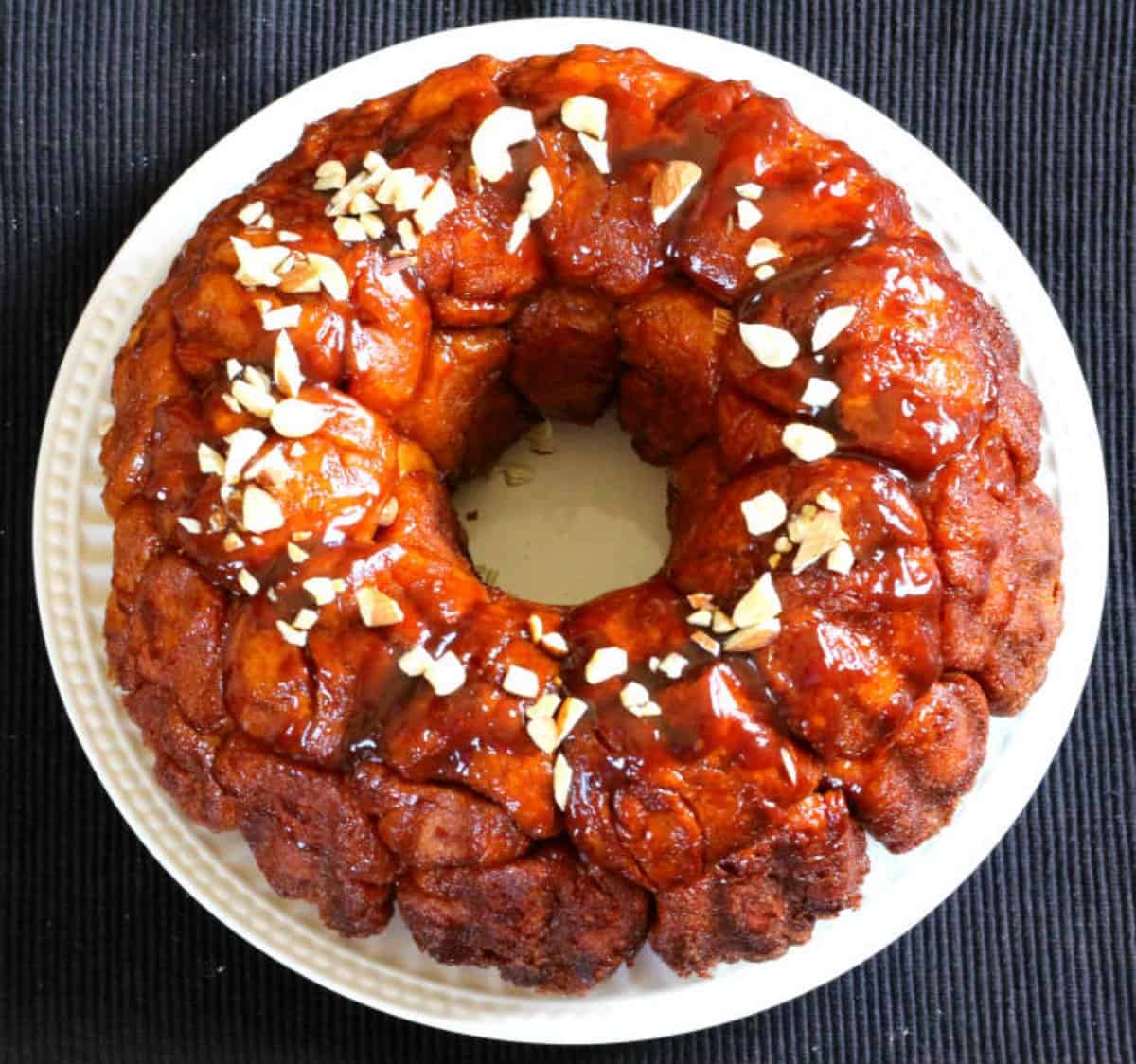 Easy and Quick Classic Pull-apart Monkey bread served on a white ceramic plate.