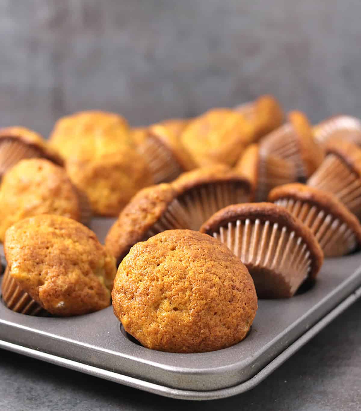 tasty and easy banana muffins baked to perfection in grey muffin pan.