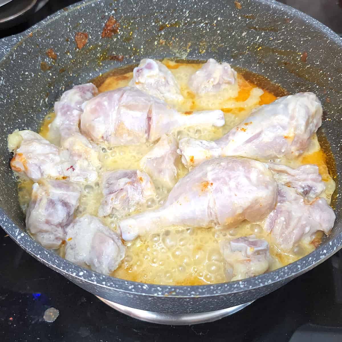 Add marinated chicken to a nonstick pan on medium-high heat.