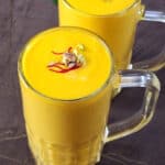 best and simple Mango smoothie (mango lassi) served in glass.