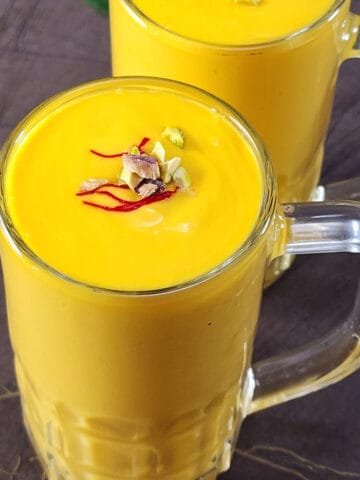best and simple Mango smoothie (mango lassi) served in glass.